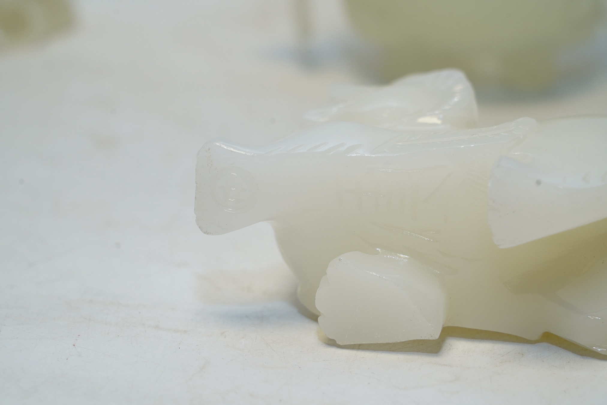Four Chinese bowenite jade pieces including carving of a bird, largest 20cm. Condition - fair